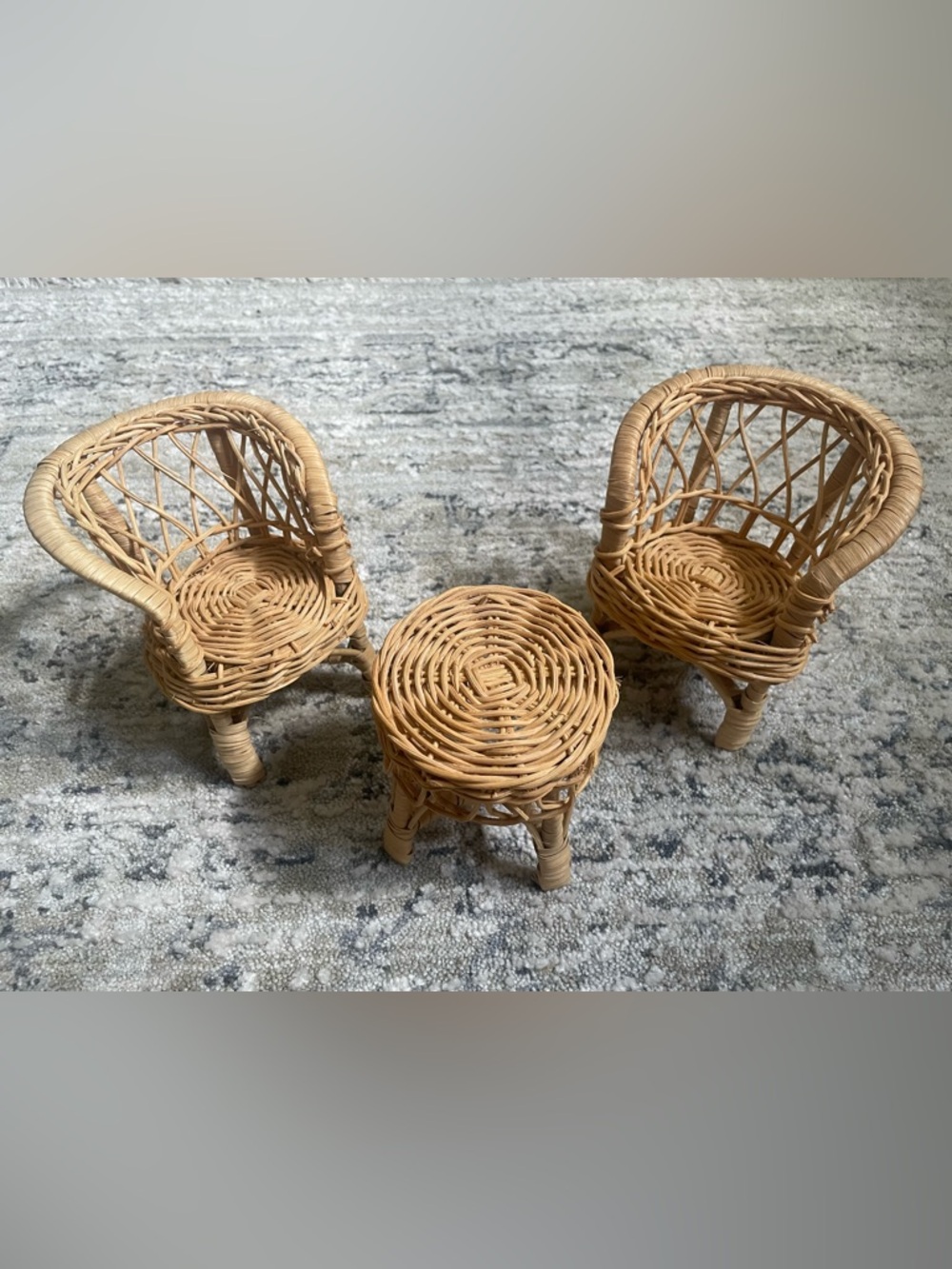 Vintage rattan doll chair and table set.